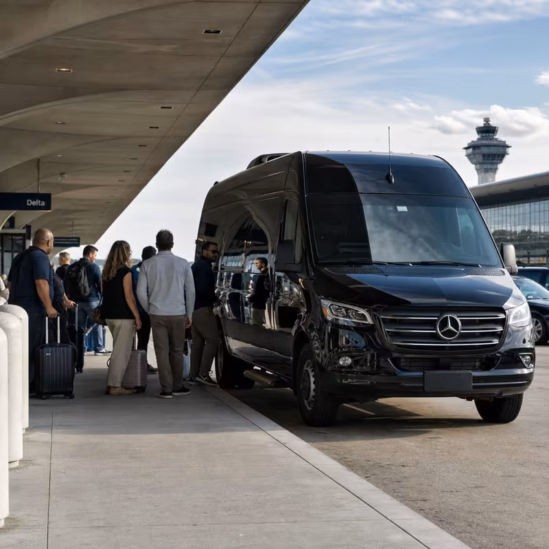Group boarding a white charter bus for Airport Transportation transportation in Washington