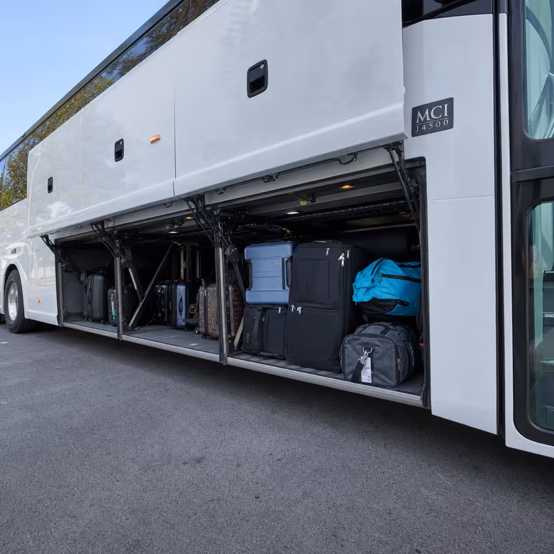 Party bus interior with wraparound leather seating and LED lighting in Washington