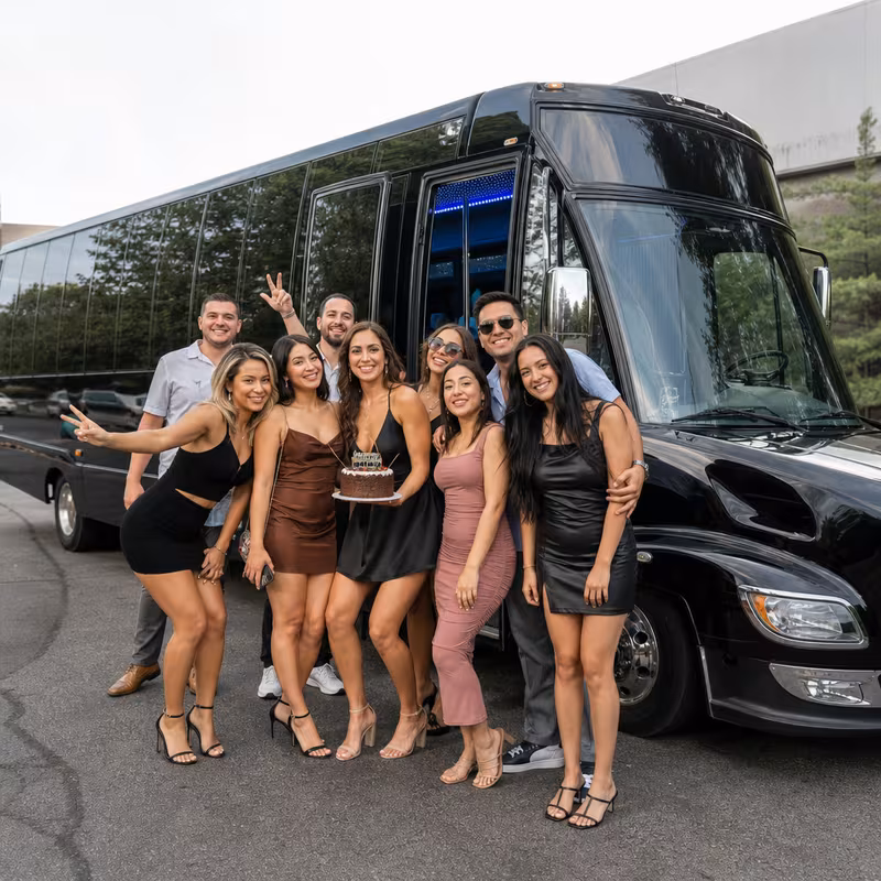 Group boarding a white charter bus for Birthday Transportation transportation in Washington