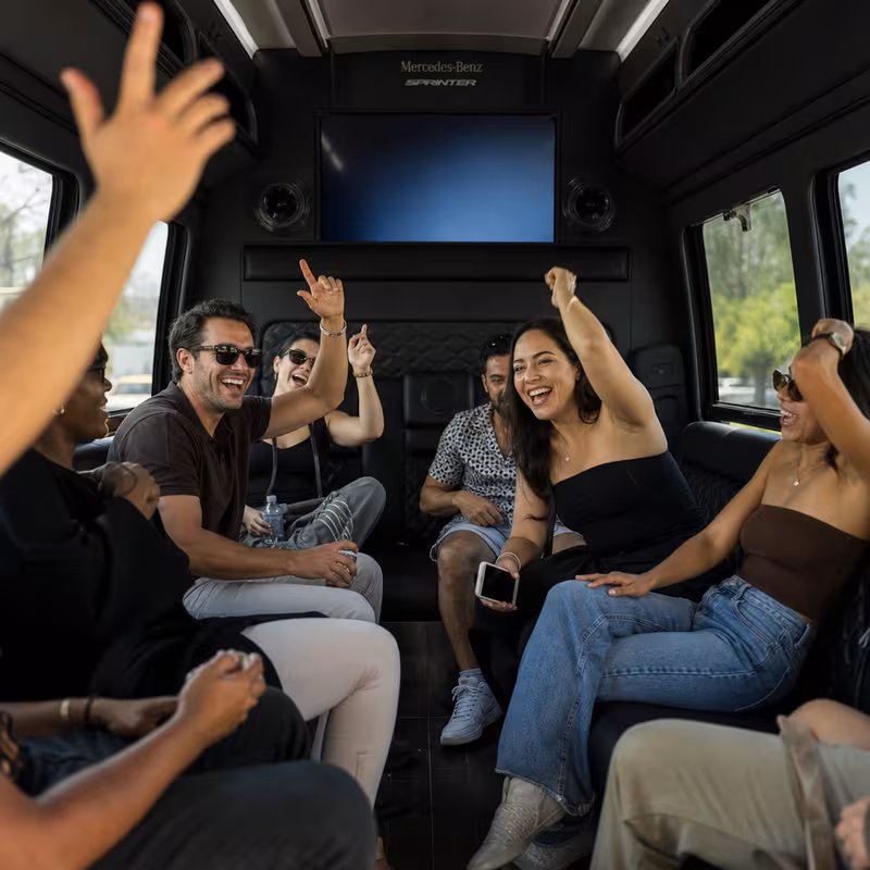 Group boarding a white charter bus for Concert Transportation transportation in Washington
