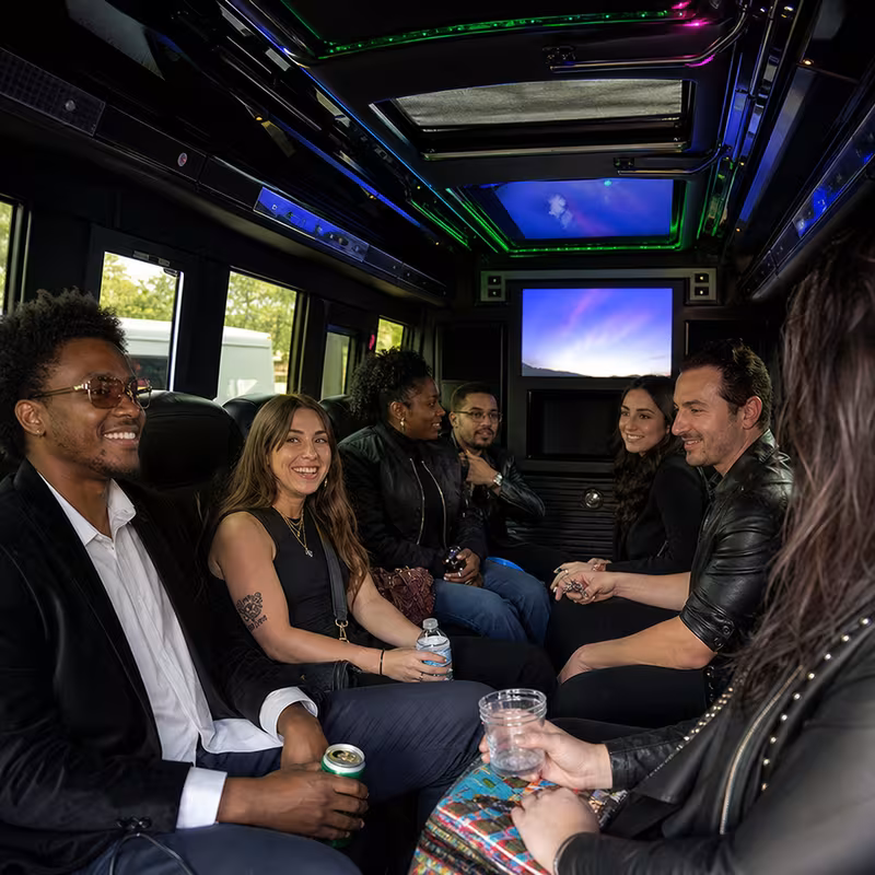 Passengers loading luggage while boarding an Washington group shuttle
