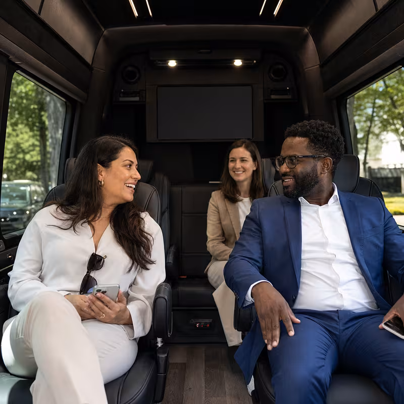 Group boarding a white charter bus for Corporate Transportation transportation in Washington