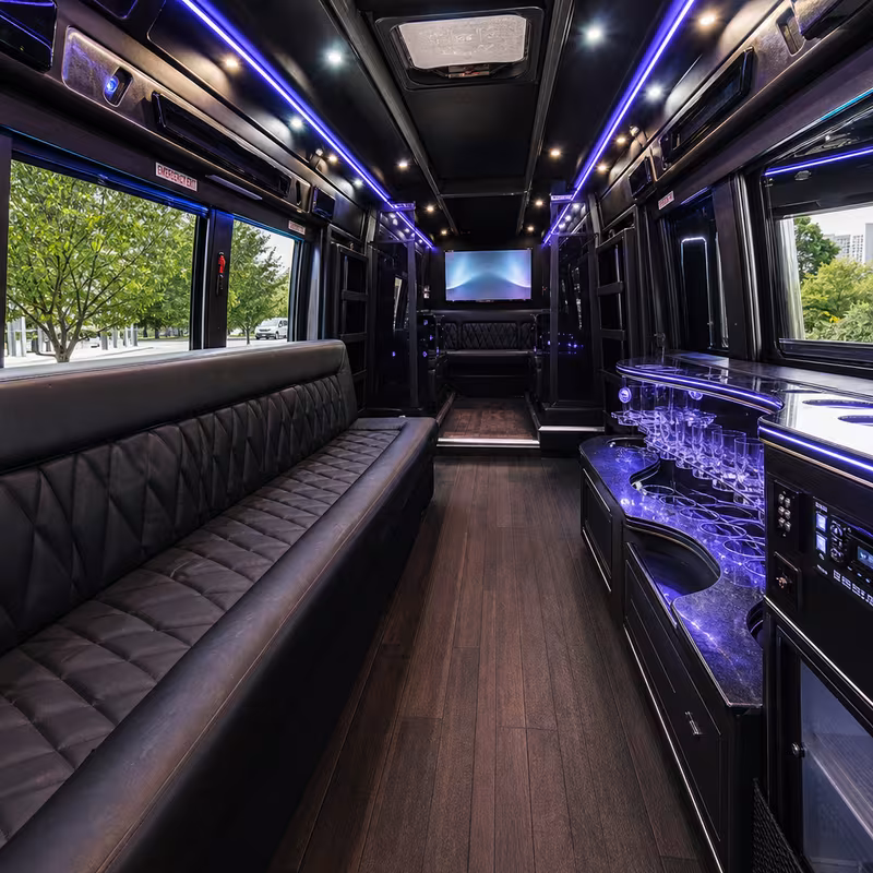 Party bus interior with wraparound leather seating and LED lighting in Washington