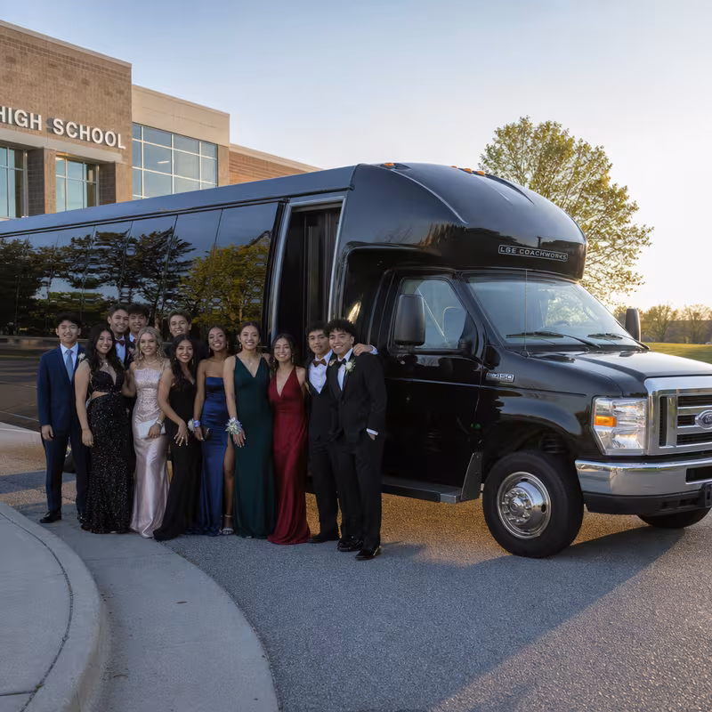 Group boarding a white charter bus for Prom & Homecoming Transportation transportation in Washington