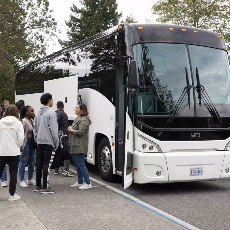 Black Mercedes Sprinter van staged for an Washington School Transportation group