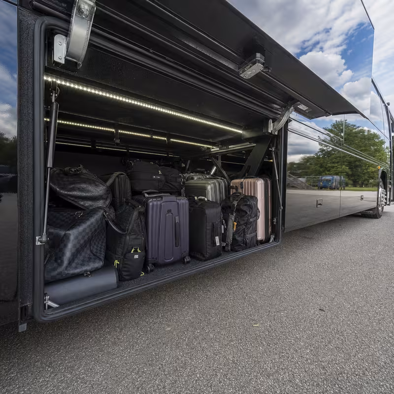 Party bus interior with wraparound leather seating and LED lighting in Washington